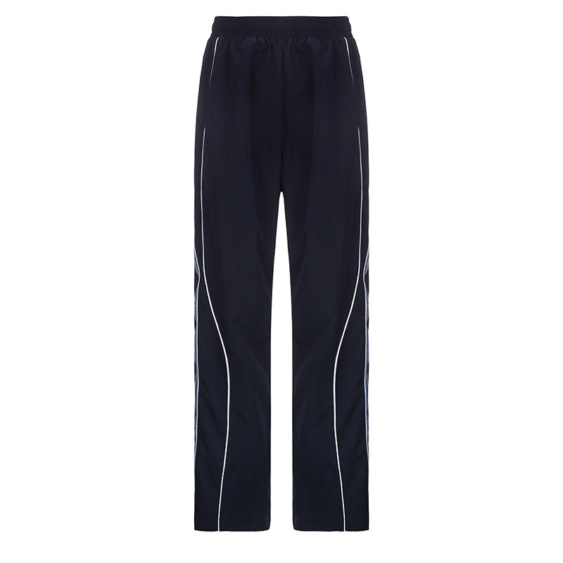 Ladies' sporty training pants with straight leg, elastic comfort waistband, and decorative side piping Mune Fashion