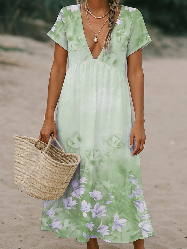 Ladies max dress with deep V-neck and flowing skirt Mune Fashion