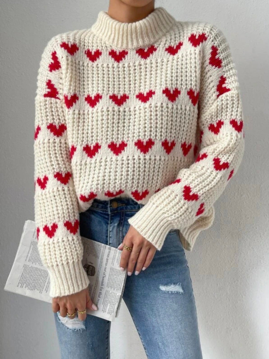 Women's chunky knit sweater with knitted heart patterns, high stand-up collar, and relaxed oversized silhouette Mune Fashion