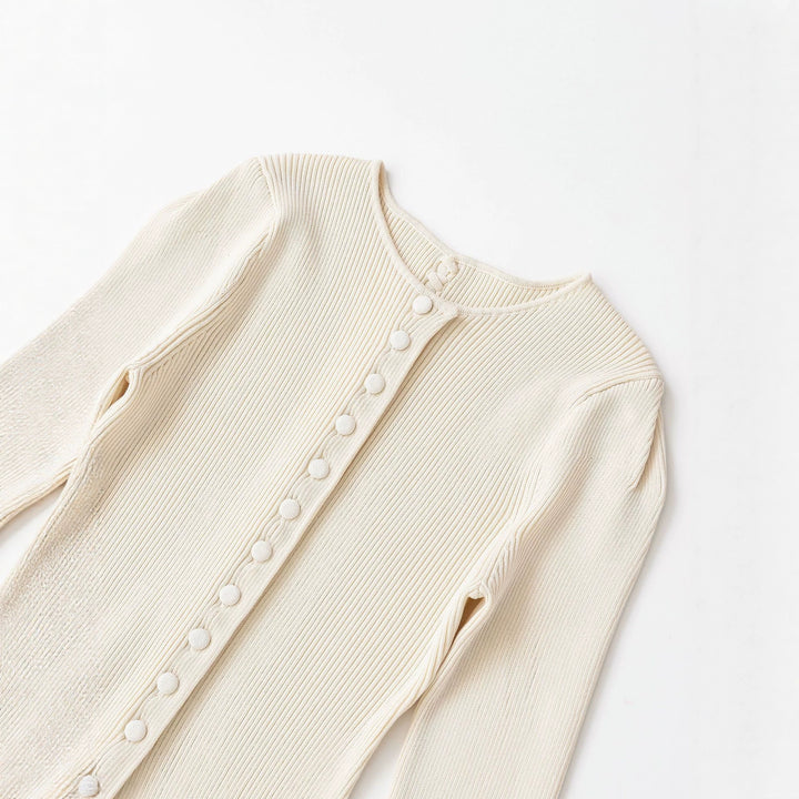 Women's fine knit cardigan with full button placket, tailored ribbed structure, and curved hem Mune Fashion
