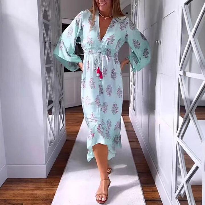 Women’s airy-flowing Boho midi dress with V-neck, gathered smock waist, drawstring with tassels, and asymmetrical ruffled hem Mune Fashion