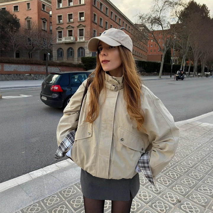 Women’s short bomber jacket with stand-up collar, chin strap, and checkered sleeve lining Mune Fashion