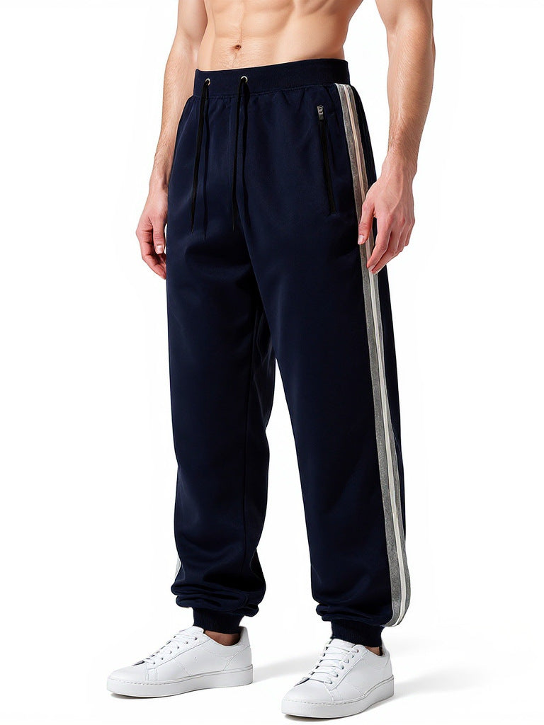 Men's sporty jogging pants with elastic waistband and side zip pockets Mune Fashion