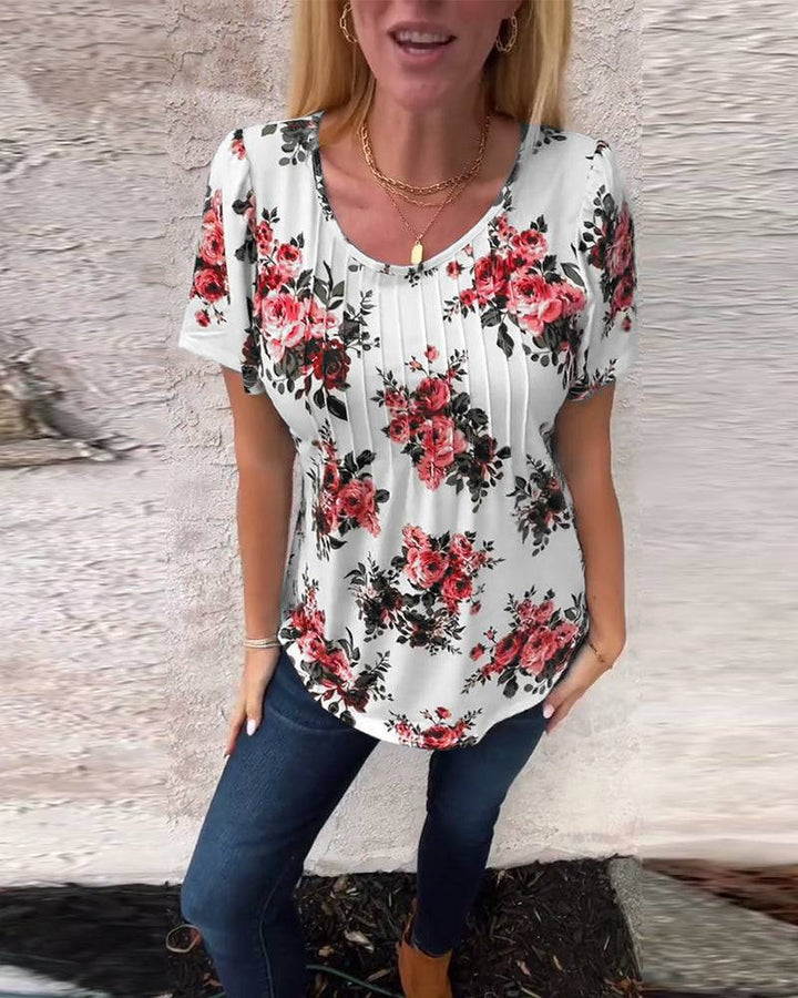 Ladies cropped short sleeve blouse shirt with box pleats and floral print Mune Fashion