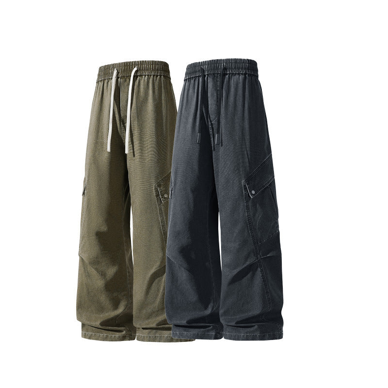 Men's loose utility cargo pants in baggy cut with drawstring waistband and large flap pockets.