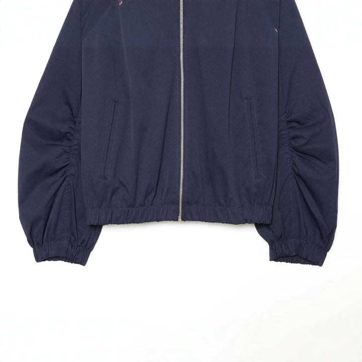 Women's cropped blouson with high stand-up collar, voluminous gathered sleeves and metal zipper Drune