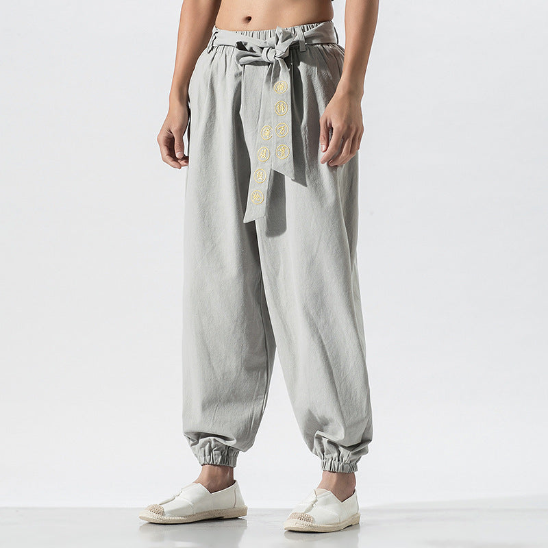 Women's wide linen trousers with drawstring waistband, binding detail, and elastic ankle cuffs Mune Fashion
