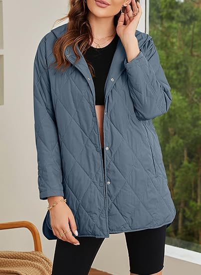 Women's quilted hooded jacket with snap button placket, side slits, and medium length Mune Fashion