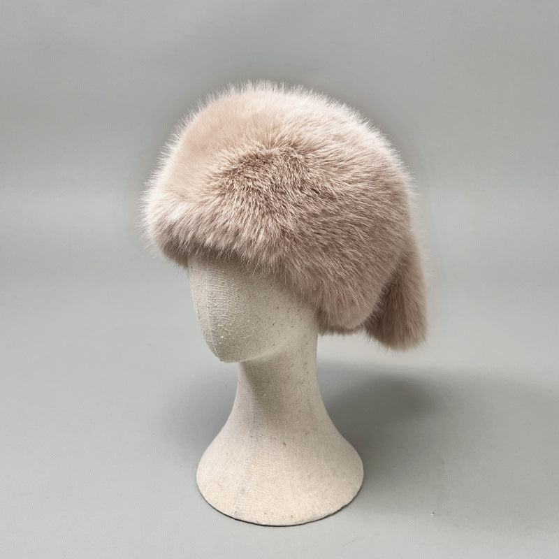 Women’s plush faux fur trapper hat with earflaps and decorative tail Mune Fashion