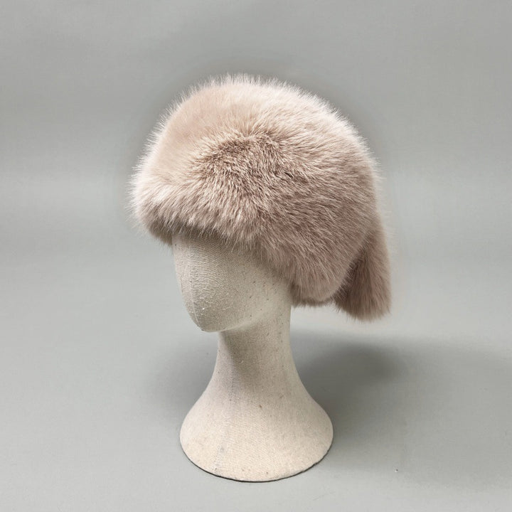 Women’s plush faux fur trapper hat with earflaps and decorative tail Mune Fashion