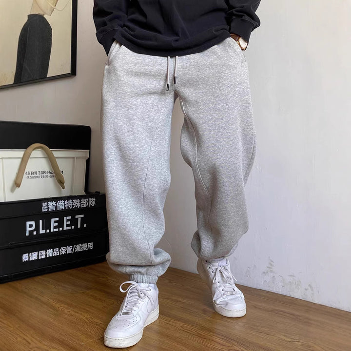 Men's nan tapered jogging pants with distinctive seam, drawstring, and elastic ankle cuffs Mune Fashion