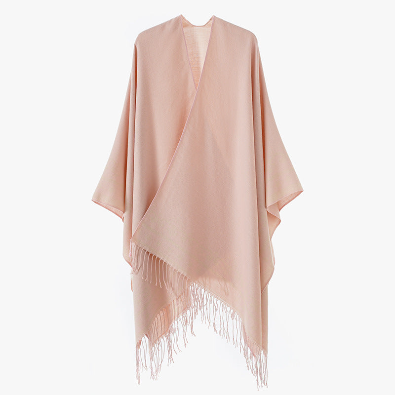 Women's poncho wrap made of wool blend with subtle jacquard border pattern and fringed hem Mune Fashion