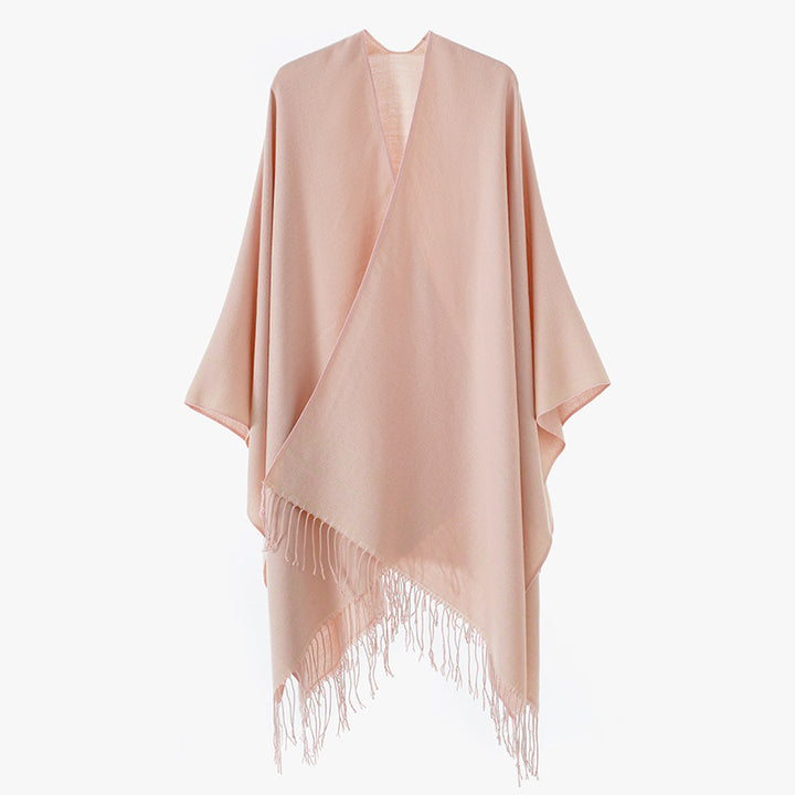 Women's poncho wrap made of wool blend with subtle jacquard border pattern and fringed hem Mune Fashion