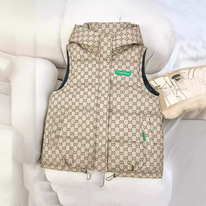 Women's quilted hooded vest with all-over logo print, padded insulation, adjustable hem, and concealed zip pockets Mune Fashion