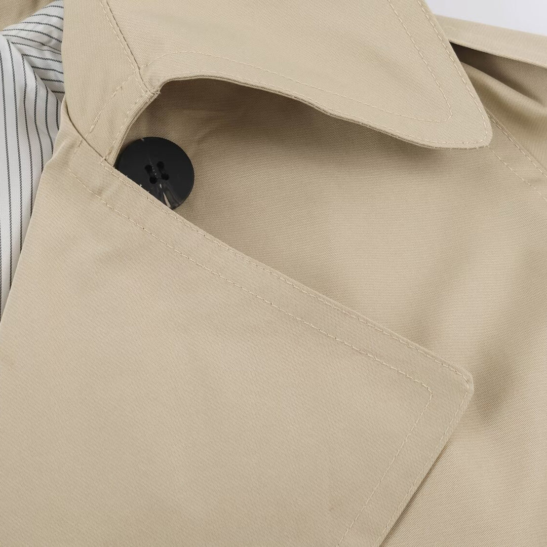 Women's short lightweight trench coat with tie belt, dropped shoulders and double button placket Mune Fashion