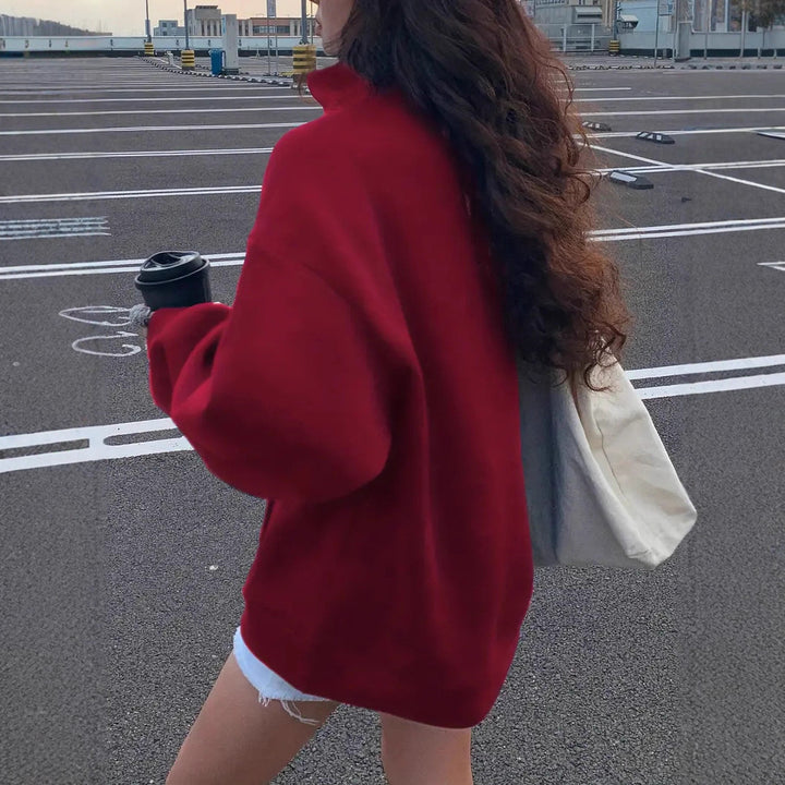 Women's oversized half-zip sweatshirt with high collar, kangaroo pocket, and casual oversized fit Mune Fashion