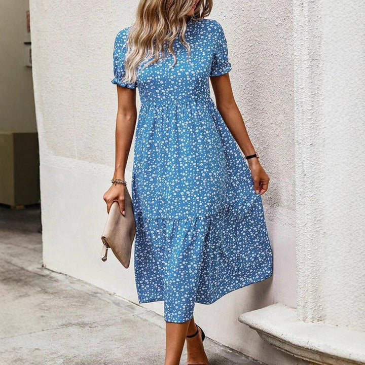 Women's airy midi dress with all-over floral pattern, gathered waist seam and short puff sleeves Mune Fashion