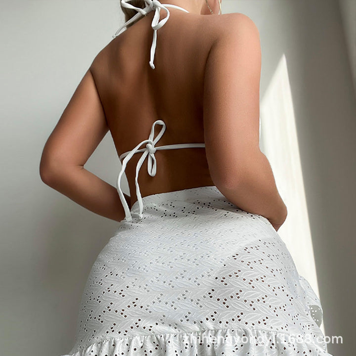 Women's triangle bikini with playful hole pattern and matching skirt Mune Fashion