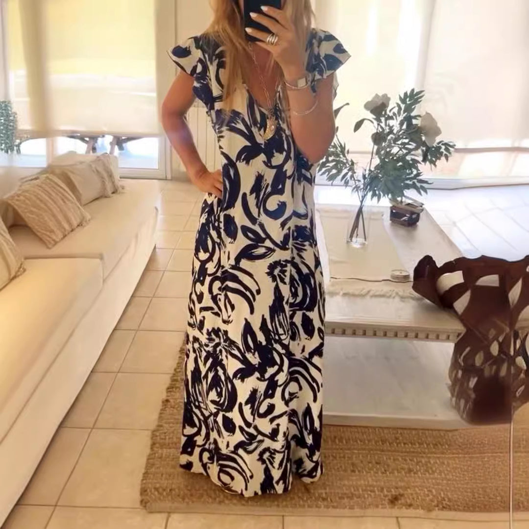 Women's flowing maxi dress with V-neck, flutter sleeves, and side leg slit Mune Fashion
