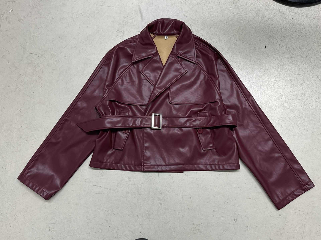Women's short faux leather trench coat with waist belt, wide lapel and cape detail Mune Fashion