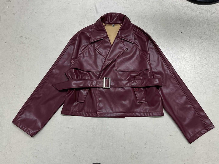 Women's short faux leather trench coat with waist belt, wide lapel and cape detail Mune Fashion