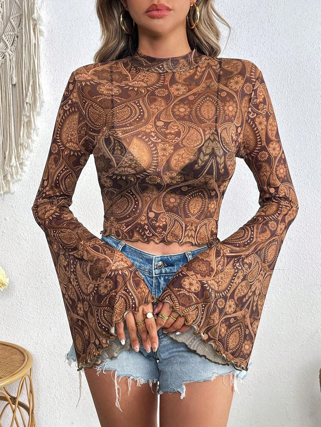 Women's transparent Paisley mesh crop top with high collar, trumpet sleeves, and wavy hem Mune Fashion