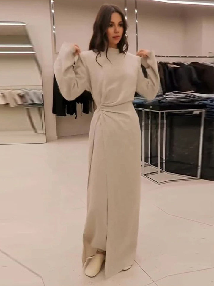 Women’s maxi dress with tailored silhouette, flared skirt and striking shoulders Mune Fashion