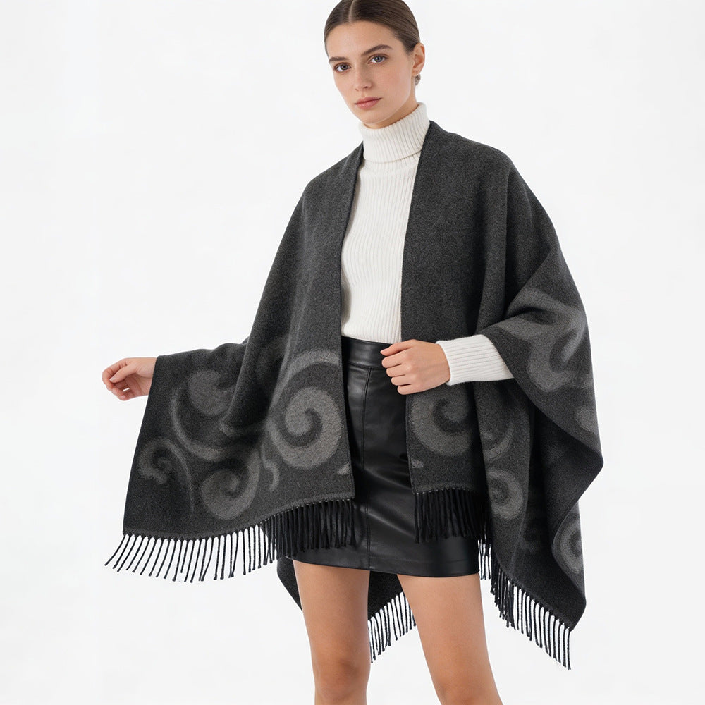 Women's wool blend poncho with jacquard swirl pattern, V-neck and fringes