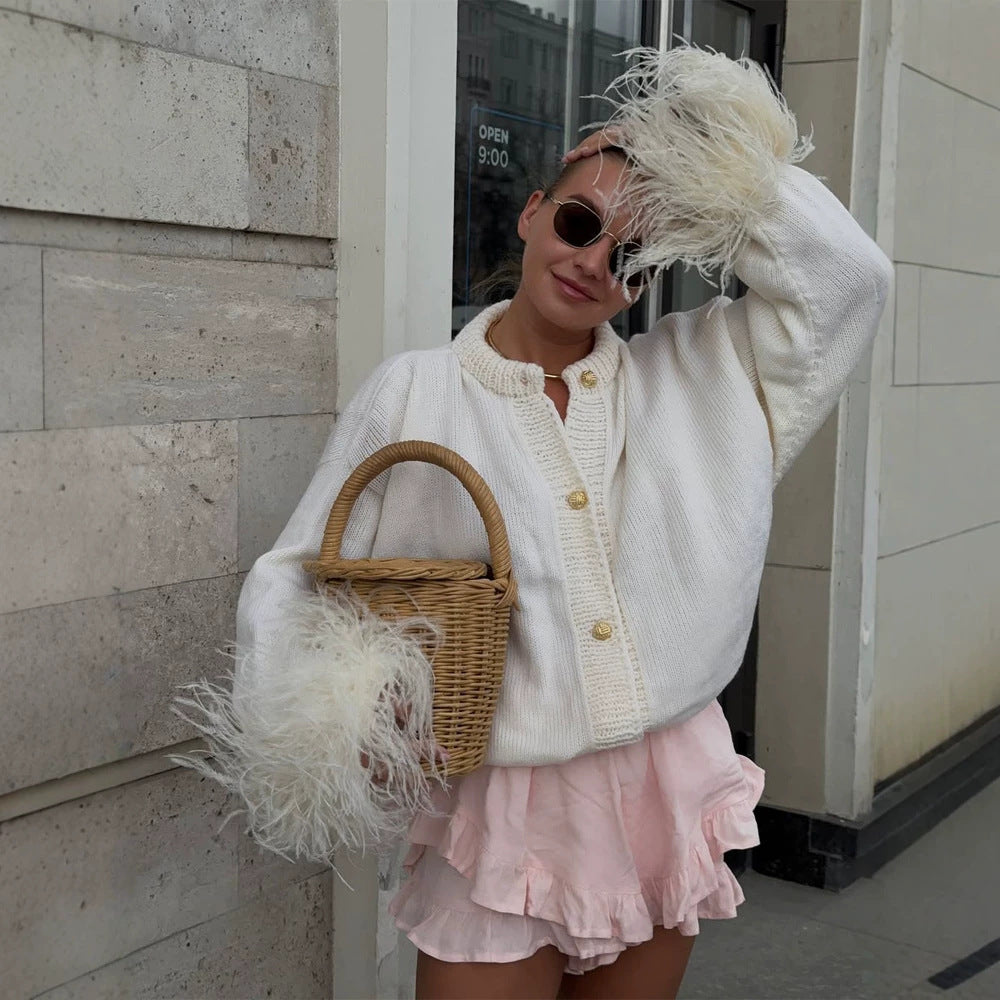 Women's knitted cardigan with feather trim at sleeve cuffs and golden decorative buttons Mune Fashion