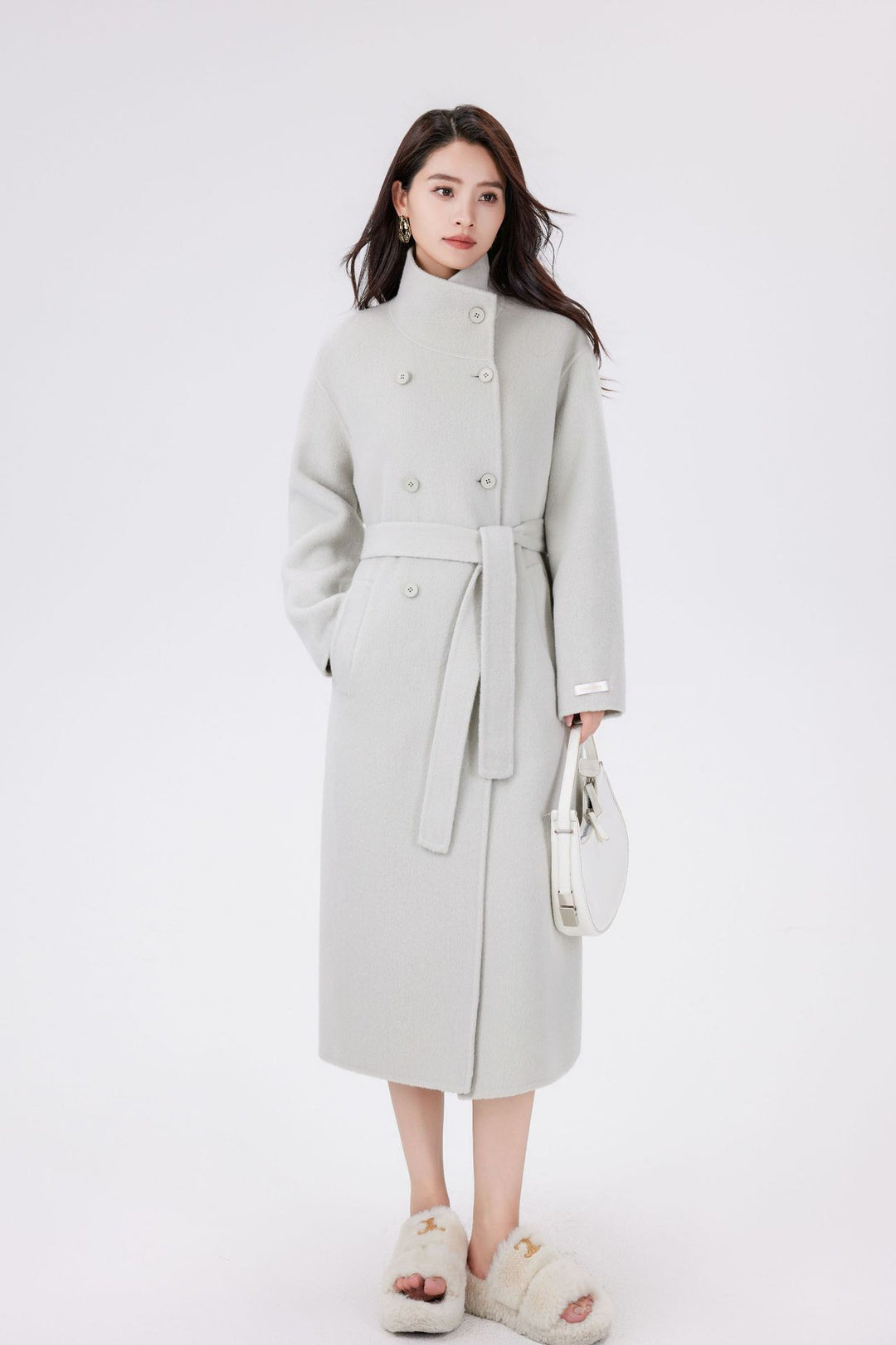 Women’s wool coat with double-breasted button placket, waist belt, and stand-up collar Mune Fashion