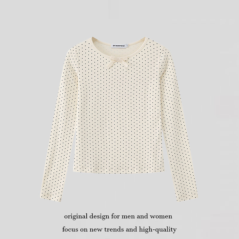 Women's long sleeve shirt made of soft cotton jersey with polka dot pattern and decorative knot on top
