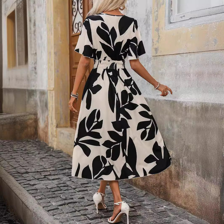Women’s wrap midi dress with elastic smocked waistband, wide batwing sleeves, and high leg slit Mune Fashion
