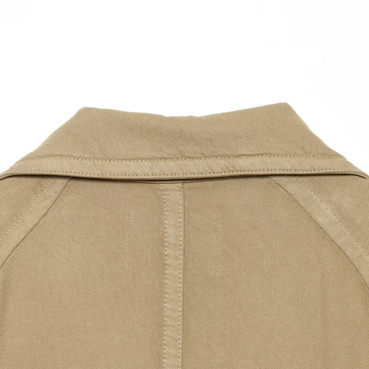 Women Cropped Trench Cape Jacket with double-breasted button placket, shoulder patches and tie belt Mune Fashion