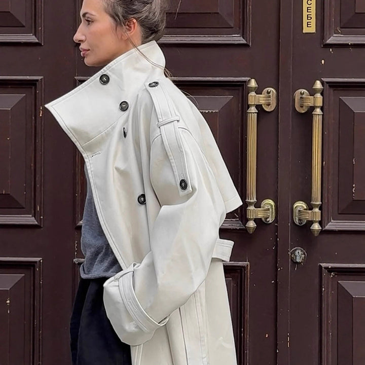Women's waistless long trench coat in oversized cut with double button placket and shoulder epaulettes Mune Fashion