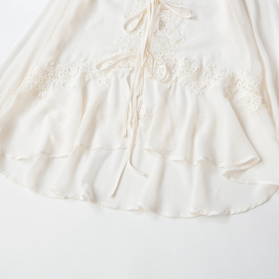 Ladies tunic blouse with lace appliqué, tying ribbons and ruffled hem Mune Fashion