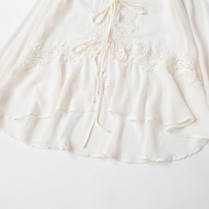 Ladies tunic blouse with lace appliqué, tying ribbons and ruffled hem Mune Fashion