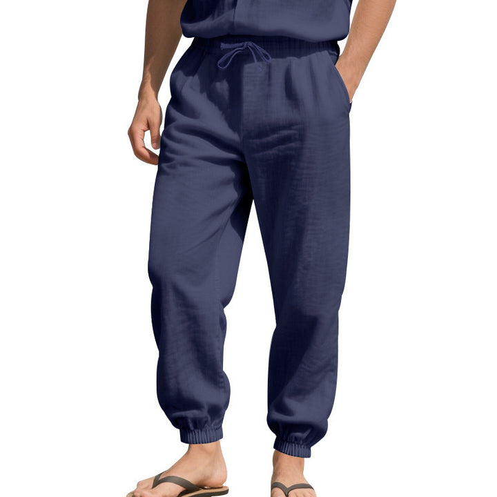 Men's light linen pants with elastic tunnel drawstring waistband, side pockets, and smocked cuffs Mune Fashion