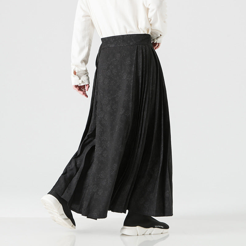 Women's maxi skirt with wide waistband, ornamental border and pleated folds Mune Fashion