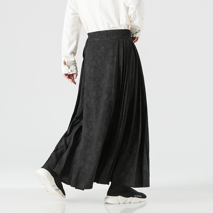 Women's maxi skirt with wide waistband, ornamental border and pleated folds Mune Fashion