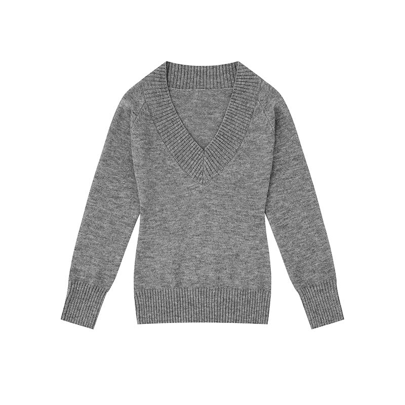 Women's fine knit pullover with deep V-neck, wide ribbed hem, and relaxed fit Mune Fashion