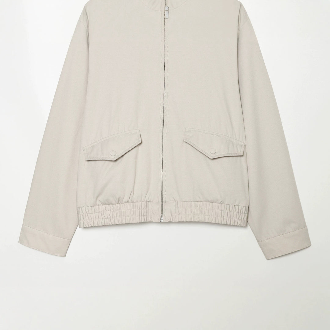 Women's short cut windbreaker with standing collar, press button placket, and elastic hem Mune Fashion