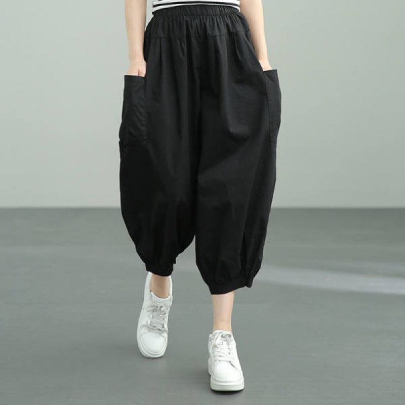 Women's wide harem pants with elastic waistband and applied side pockets Mune Fashion