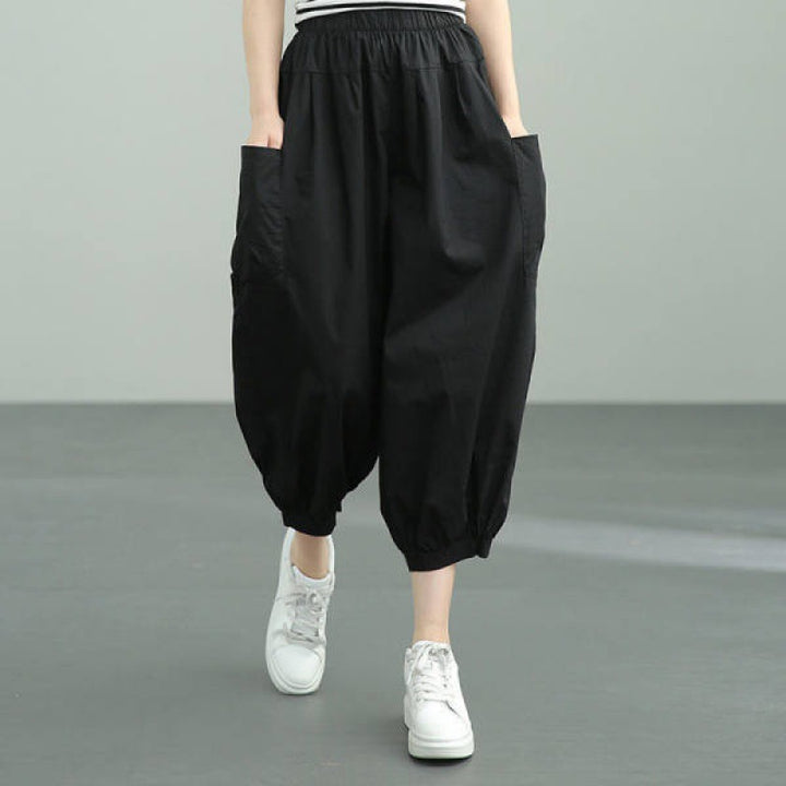Women's wide harem pants with elastic waistband and applied side pockets Mune Fashion