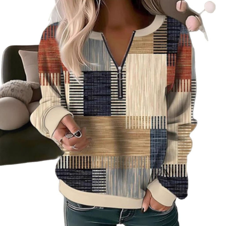 Women's cozy sweater with short zip, graphic patchwork pattern, extended sleeve cuffs, and ribbed hem Mune Fashion