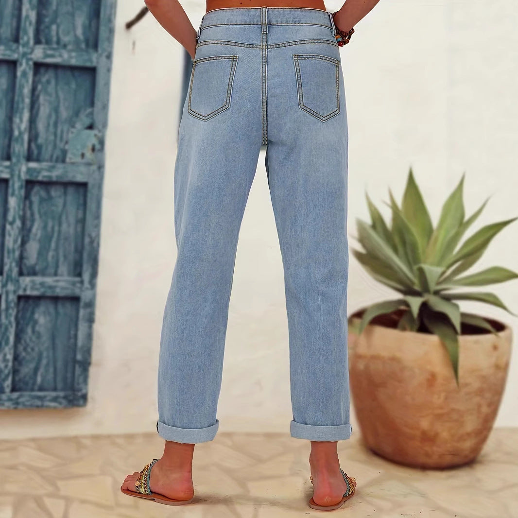Ladies straight-cut jeans with colorful floral appliqués and light destruction details Mune Fashion