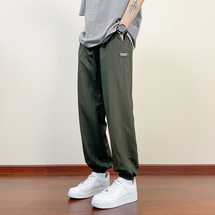 Men's sporty jogging pants with reflective details
