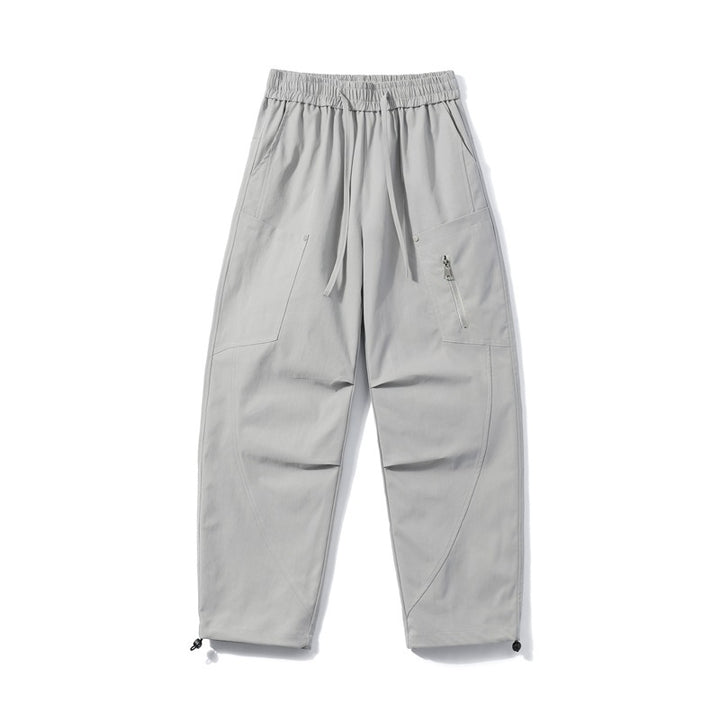 Men's utility cargo pants with elastic waistband, zip pocket, and adjustable hem.