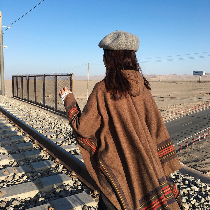Women's hooded cape poncho in tartan pattern with fringed hem made of soft wool blend Mune Fashion
