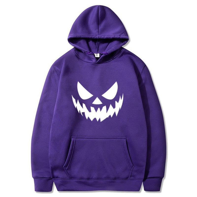 Unisex hooded sweatshirt with creepy pumpkin face print and oversized kangaroo pocket Mune Fashion