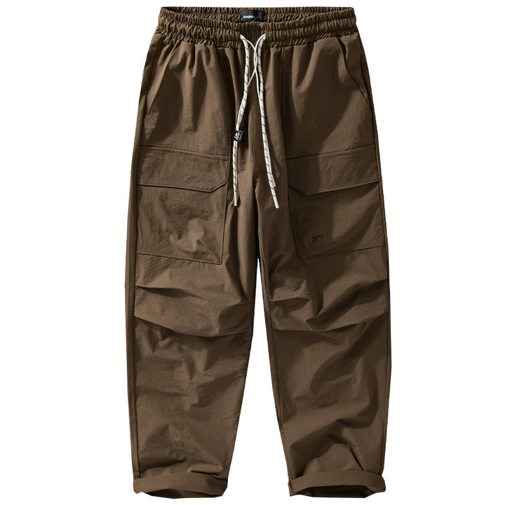 Men's Oversized Cargo Pants made of lightweight functional fabric with drawstring waistband and multiple pockets Mune Fashion